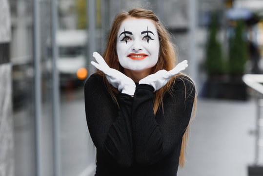 The girl with makeup of the mime. improvisation. mime shows different emotions