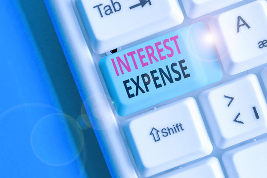 Handwriting text writing Interest Expense. Conceptual photo cost of debt that has occurred during a period of time