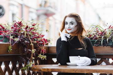 Portrait of a mime comedian. mime girl on the street