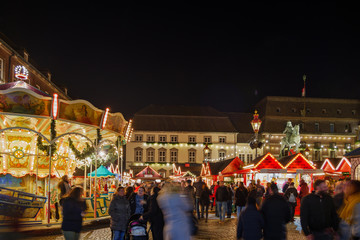 Night colourful atmosphere of Weihnachtsmarkt, Christmas market in Düsseldorf, with carousel,...