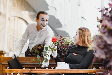 Mime on the street waiting to meet with his lover. Portrait of a mime comedian. mime on the street
