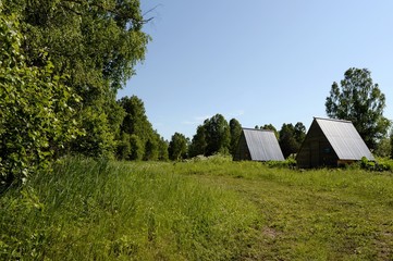 Fototapeta na wymiar Summer houses for tourists on the shore of lake Krasilovo in the Altai territory