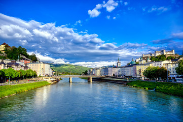 Fototapeta na wymiar A view of the Austrian city of Salzburg along the Salzach River.