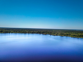 Aerial view of a lake with blue water
