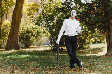 Fototapeta premium Portrait of a man, artist,clown, MIME. Shows something. Mime actor shows different emotions.