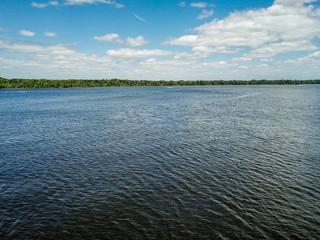 Aerial view of a large river leading to the ocean