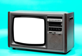 Vintage television with cut out screen on green background.