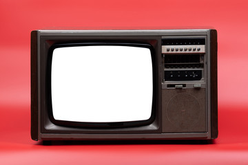 Vintage television with cut out screen on red background.