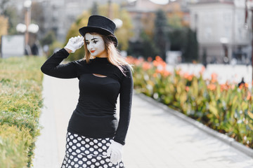 The girl with makeup of the mime. improvisation. mime shows different emotions