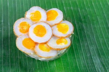 Fried Quail eggs pancake Thai appetizer at street food market Thailand.Thai desserts and snack meal.