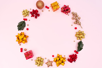 Christmas wreath on pink background. Christmas decoration. Flat lay, top view, copy space