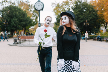 Mime on the street waiting to meet with his lover. Portrait of a mime comedian. mime on the street