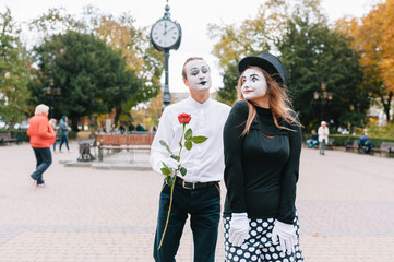 Mime on the street waiting to meet with his lover. Portrait of a mime comedian. mime on the street