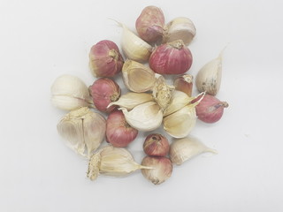 Onion Garlic Food Seasoning with Traditional Ethnic Minimalists Wooden Bowl in White Isolated Background