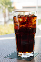 glass of soft drink with summer view
