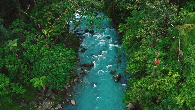 Beautiful 4K UHD aerial Cinemagraph of the famous Rio Celeste, a volcanic river in the jungle of Costa Rica with remarkably blue water in a seamless loop.