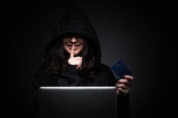 Female hacker hacking security firewall late in office