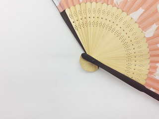 Artistic Colorful Ethnic Traditional Modern Design Hand Fan from Wood and Fabric Materials in White Isolated Background