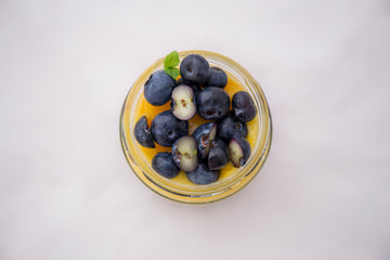 Chia pudding and mango smoothie with blueberries