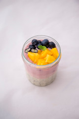 Chia pudding and acai smoothie with blueberries and mango