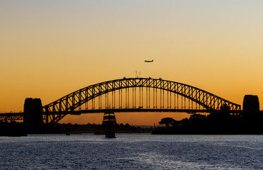 Fototapeta na wymiar Silhouette of Harbour bridge during sunset in Sydney, Australia