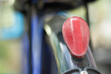 Red light bulb behind a bicycle
