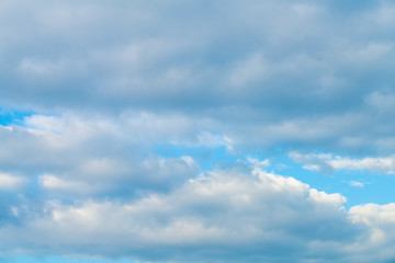 Idylic blue sky with fluffy cloud sunset