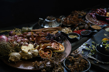 A variety spices and herbs in wooden bowls,  Of Asians For cooking.