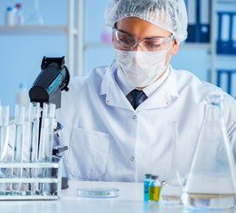 Female scientist researcher conducting an experiment in a labora