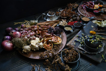 A variety spices and herbs in wooden bowls,  Of Asians For cooking.