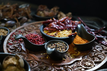 A variety spices and herbs in wooden bowls,  Of Asians For cooking.