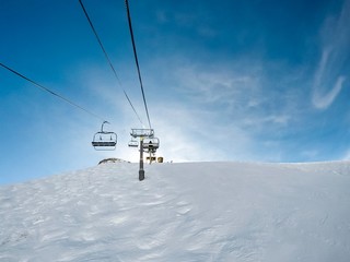 Fototapeta na wymiar ski lift in blue sky