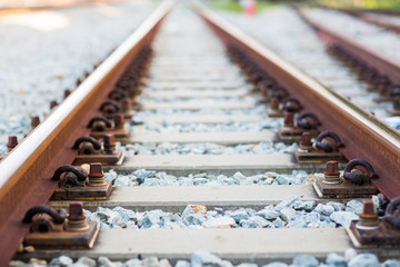 rail joint, rail anchor with perspective line from railroad  tracks. Safety transportation. Avoid traffic jam. Public transportation for reduce green house effect. Saving energy and fuel.