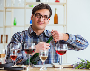 Professional sommelier tasting red wine