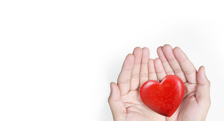 Fototapeta premium Hands holding a red heart .health donation concepts