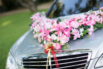 wedding car. Wedding decoration on wedding car. Luxury wedding car decorated with flowers. just...