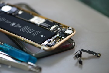 Close-up photos showing process of mobile phone repair 