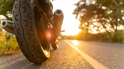 motorcycle in a sunny motorbike on the road riding.with sunset light. copyspace for your individual...
