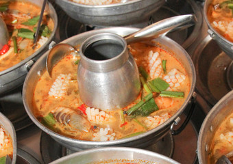 Tom Yum Seafood, shrimp, shell, fish and crab recommend Thai local food for traveler and tourist. Spicy and soul soup. image for background, copy space. objects and menu list.