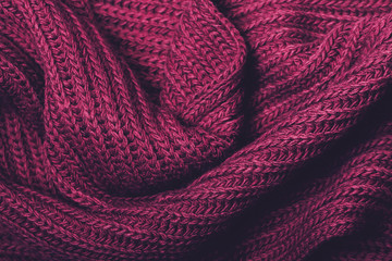 Knitted violet scarf texture. The concept of cozy, comfort, warm, softness or winter