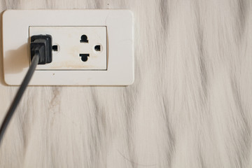 Focus white plug socket 2 channels on the wood wall. electricity for house and city. charging...