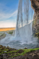 Behind the waterfall