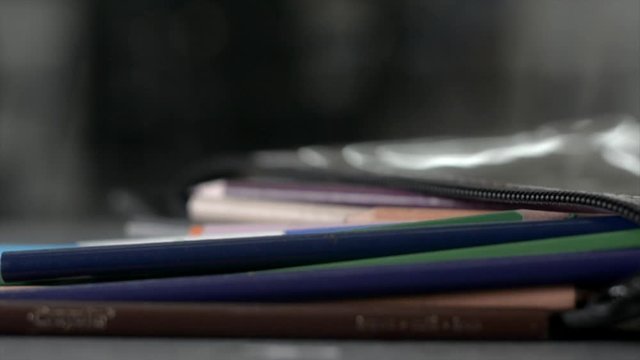 Going into a pencil case to select and use several different colors within one art piece
