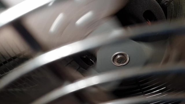 Slow motion industrial metal fan blades spinning, steampunk mechanical theme
