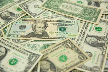 Money american hundred dollar bills Pile of various currencies isolated on white background.Closeup of assorted American banknotes.US currency scattered on the table.america currency dollor currency.