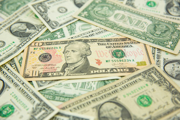 Money american hundred dollar bills Pile of various currencies isolated on white background.Closeup of assorted American banknotes.US currency scattered on the table.america currency dollor currency.
