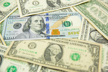 Money american hundred dollar bills Pile of various currencies isolated on white background.Closeup of assorted American banknotes.US currency scattered on the table.america currency dollor currency.