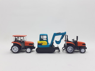 Fototapeta premium Photo Realistic Heavy Machinery Tractor Excavator Miniature Die Cast Toys Design for Souvenir Gift Collection Items in White Isolated Background 