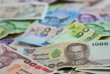 Thai money - Baht. Pile of various currencies isolated on white background. Thai baht banknote coin isolated on white background. Many of Thai Baht background. Thai currency.