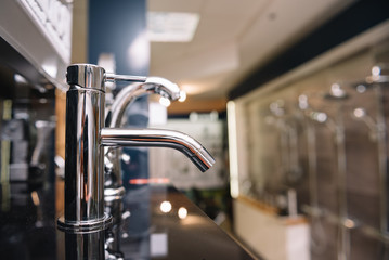 Rows of new faucets in plumbing shop, closeup